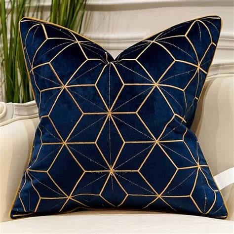 navy blue and gold cushions